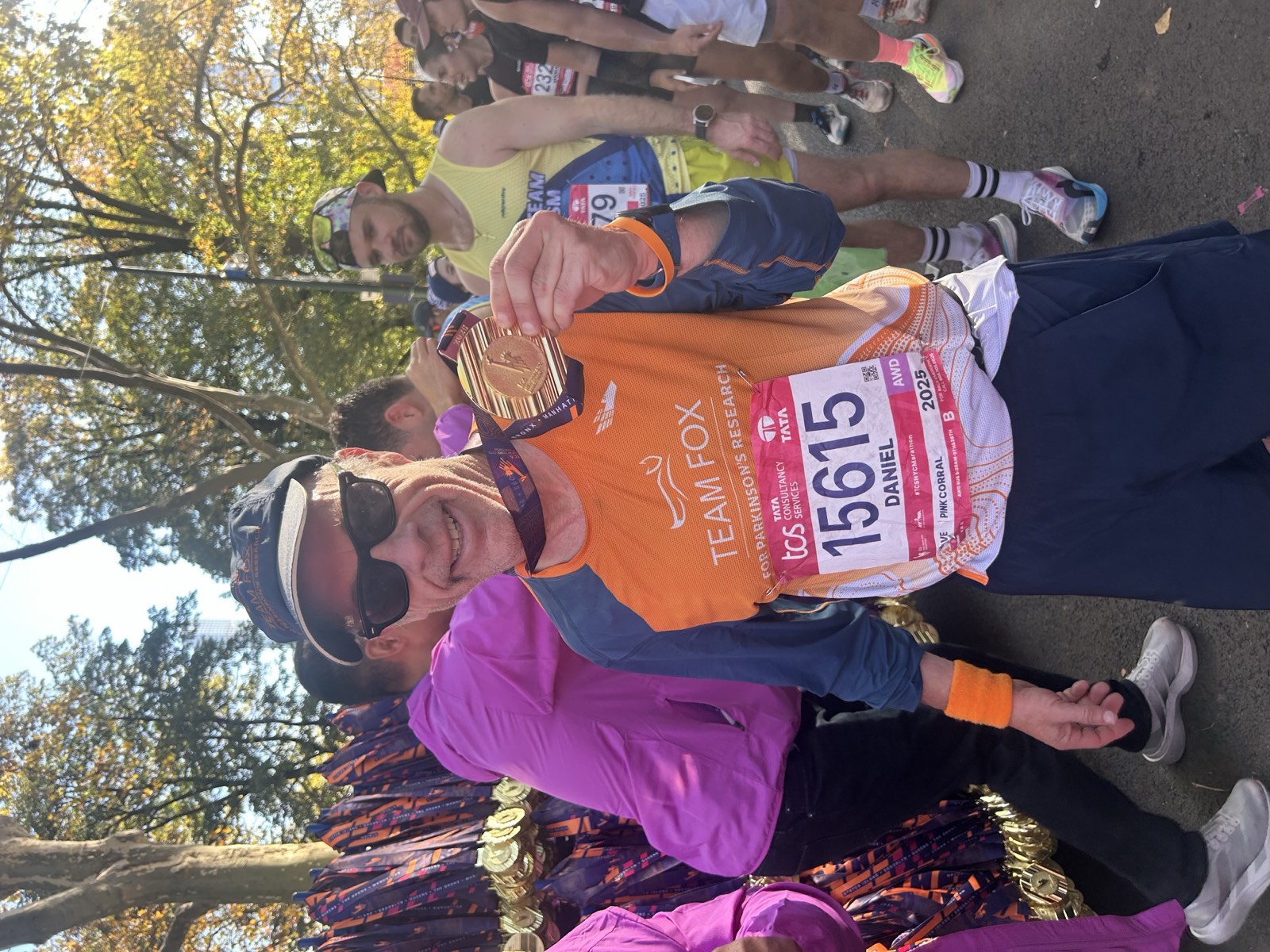 Dan Alperin finishing the TCS New York City Marathon in his Boston Children's Hospital charity singlet